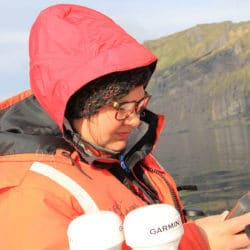 Caleb scholar collecting data in the field.